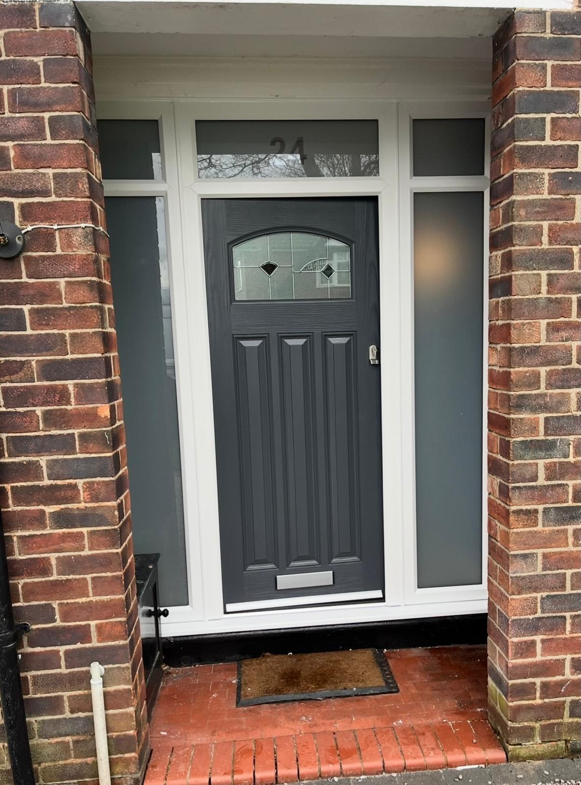 Anthracite composite front door with decorative glazing, side panels and fanlight